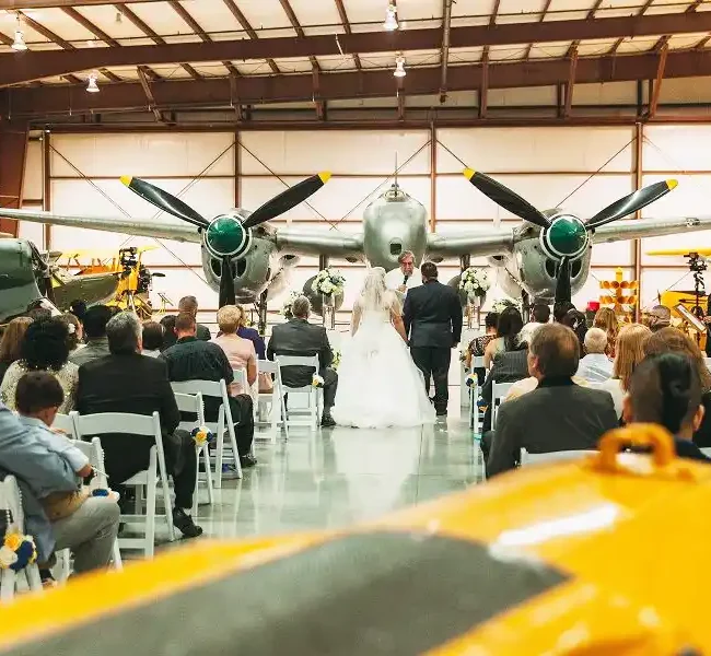 Wedding ceremony at hangar at Yanks Air Museum